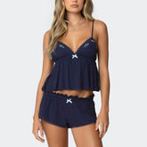Navy blue lace-trimmed top and shorts set on a white background